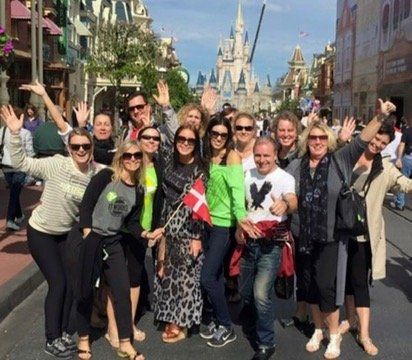 Team in front of Disney Magic Kingdom castle